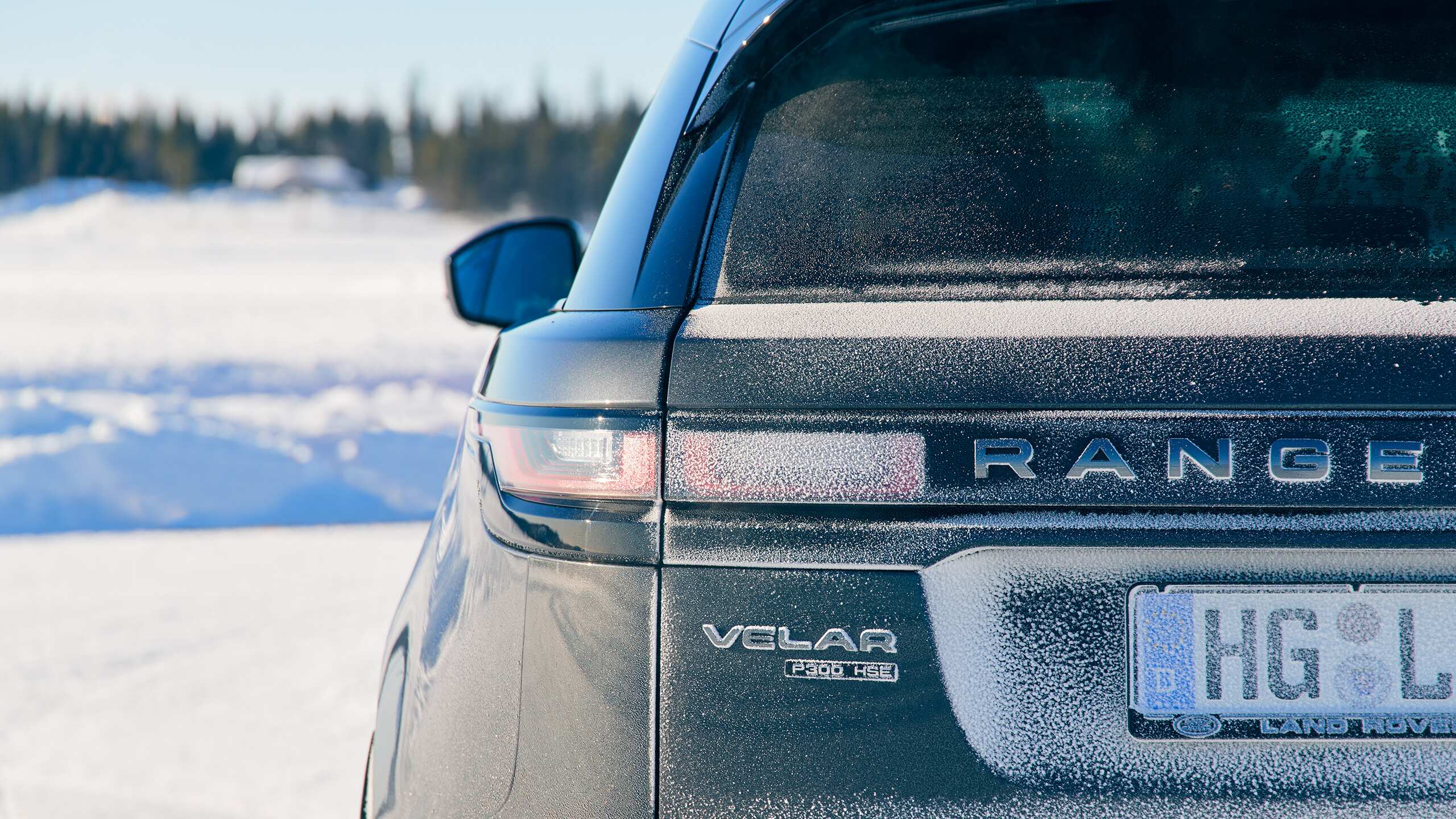 Velar car on snowy landscape, winter, back side close view